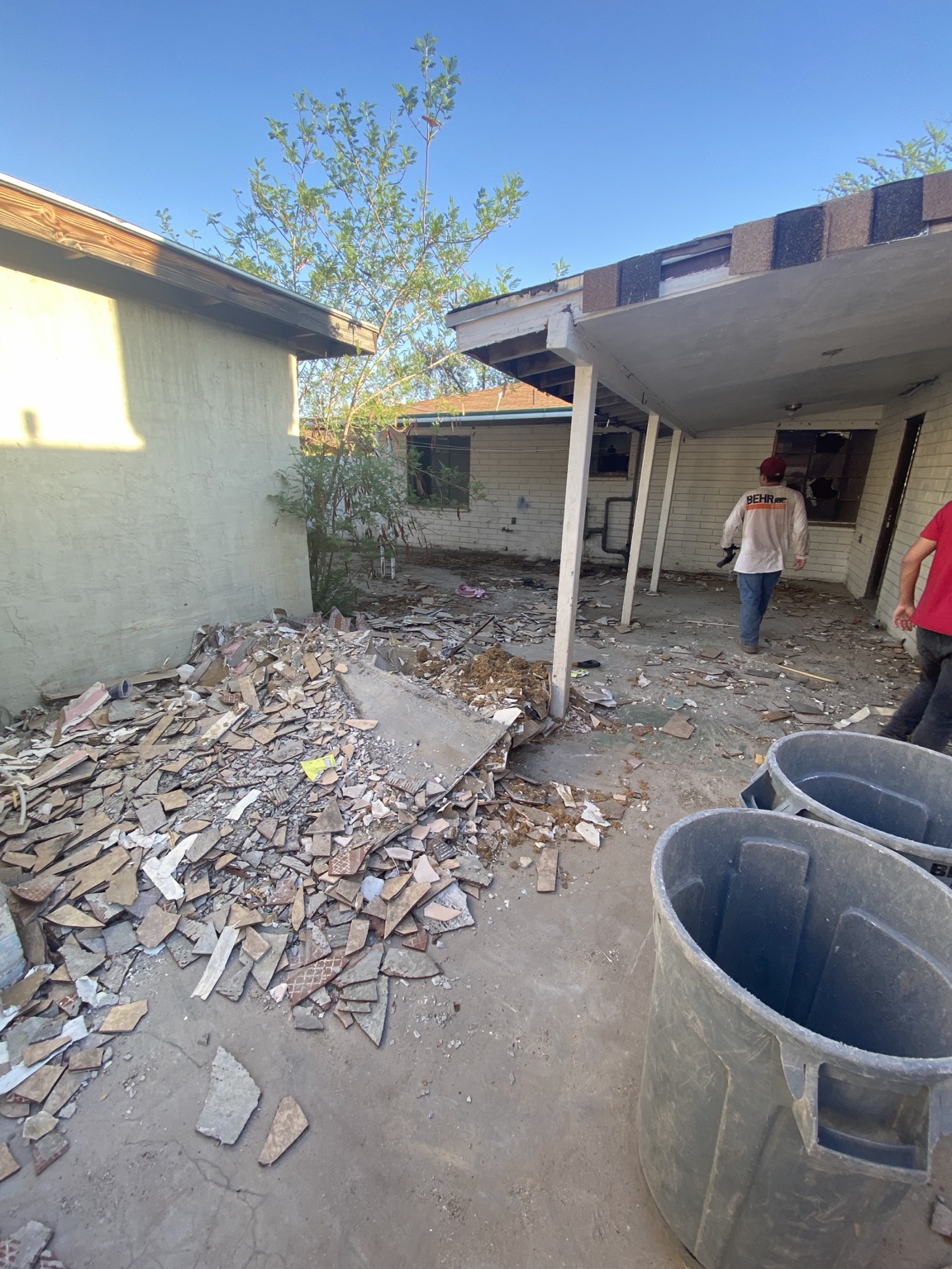 Pile of tile and debris outside before removal