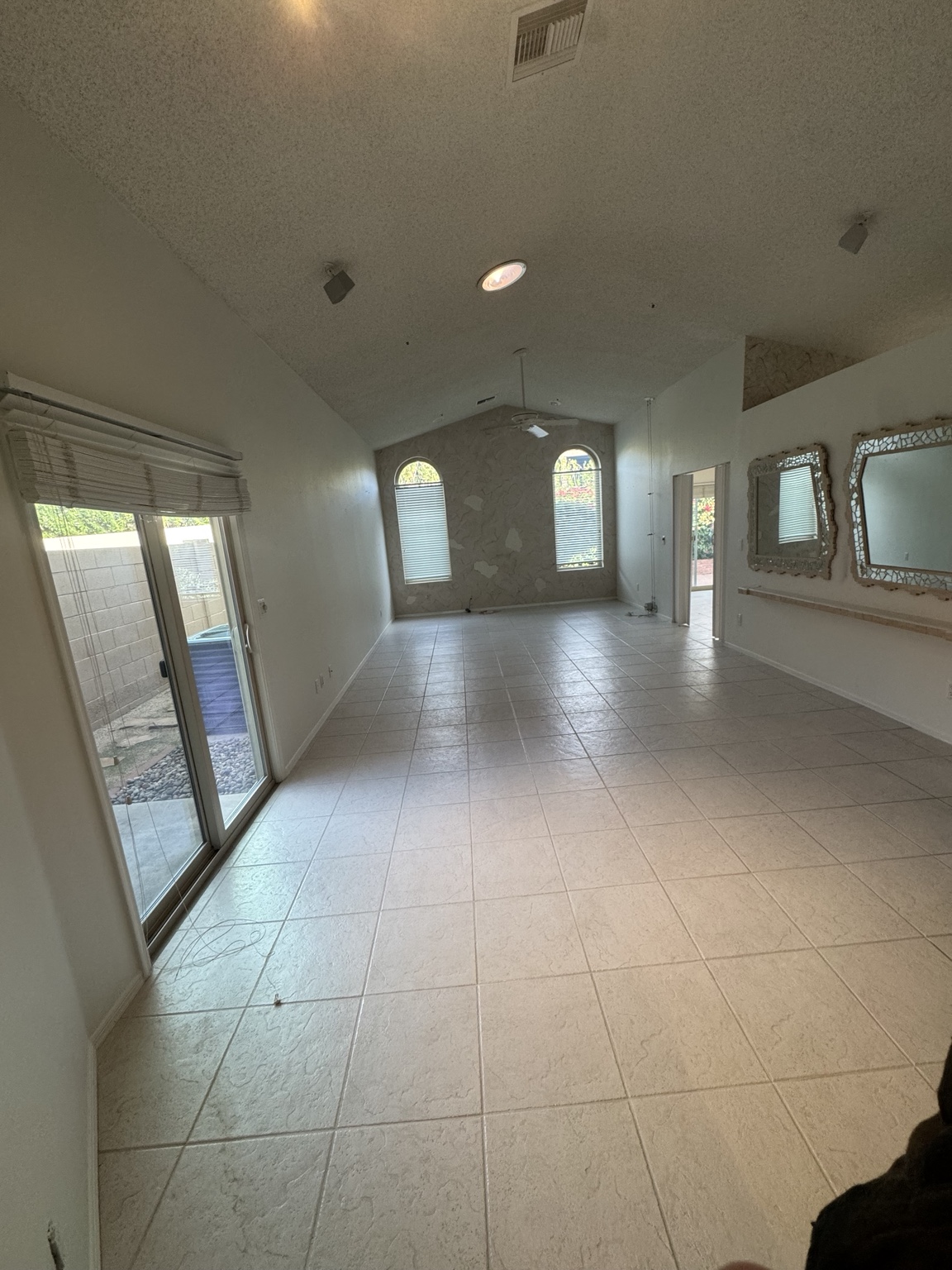 Tiled living area before floor removal